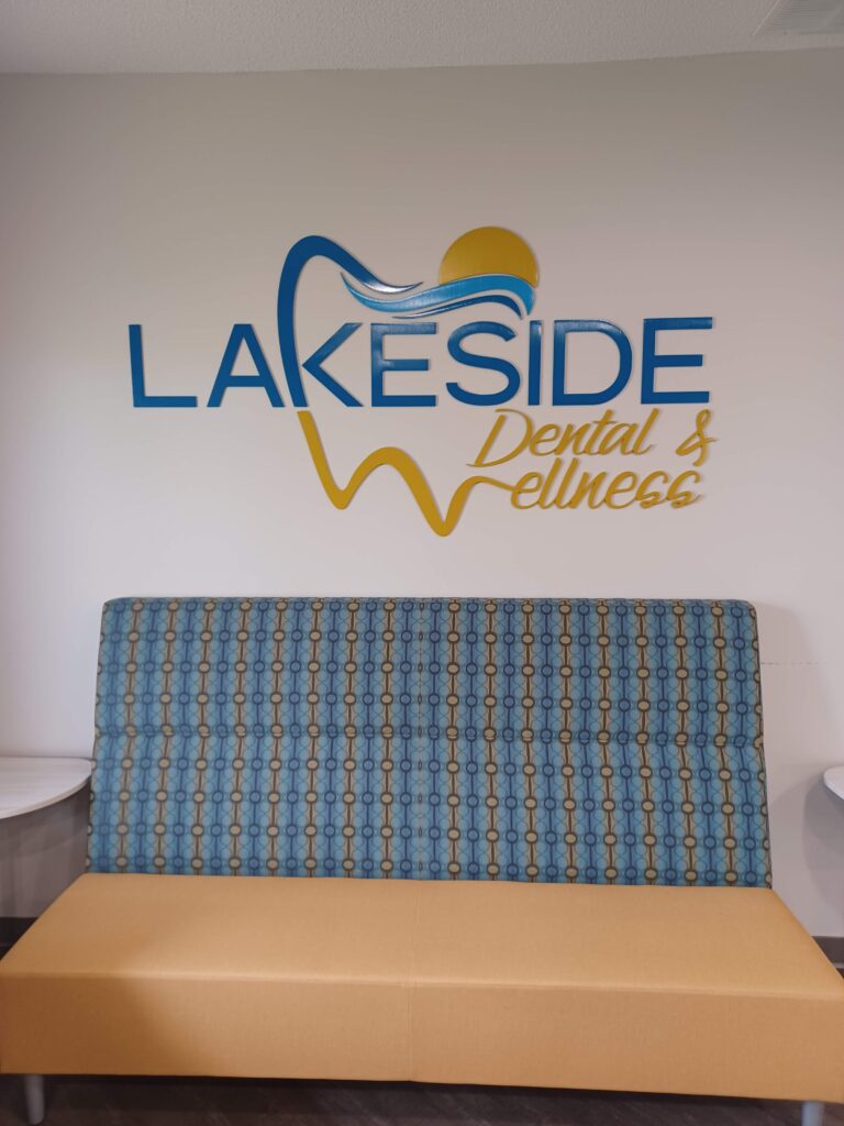 Lakeside Wellness waiting room showing wall signage and a comfortable couch
